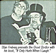 [Stan Freberg presents the Good Doctor with
his book, "It Only Hurts When I Laugh."]